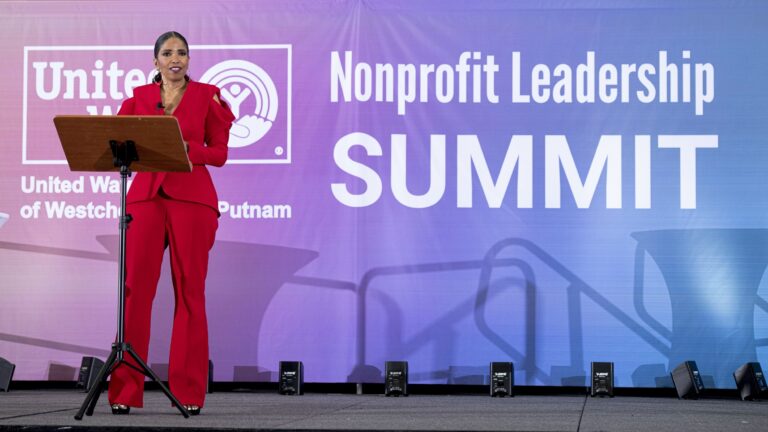 Speaker on stage at a nonprofit leadership summit