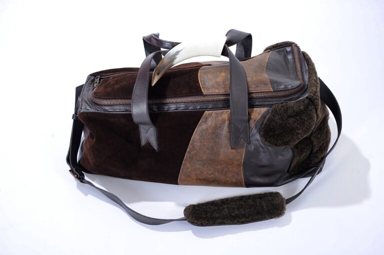 Brown duffel bag isolated on a plain background
