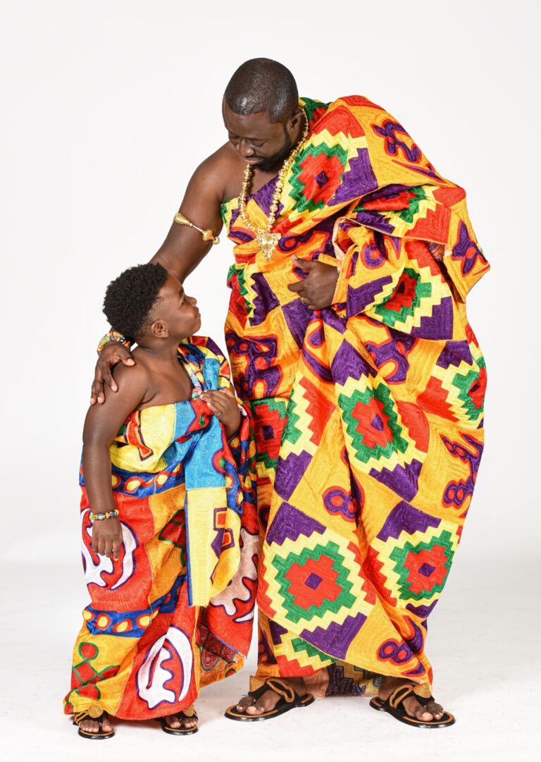 Mother and two children in coordinated colorful clothing