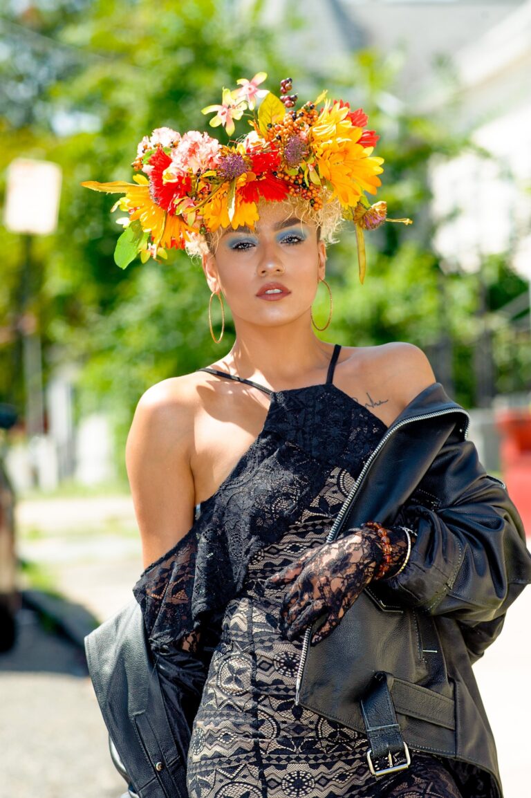 Woman wearing an orange floral headpiece outdoors