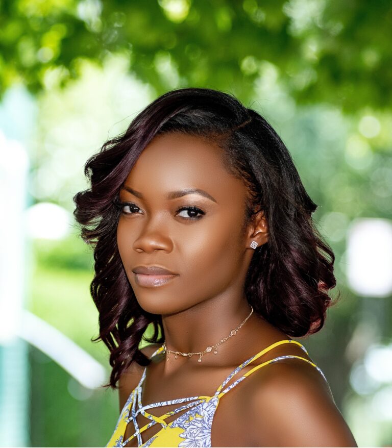 Outdoor portrait with styled hair and patterned outfit