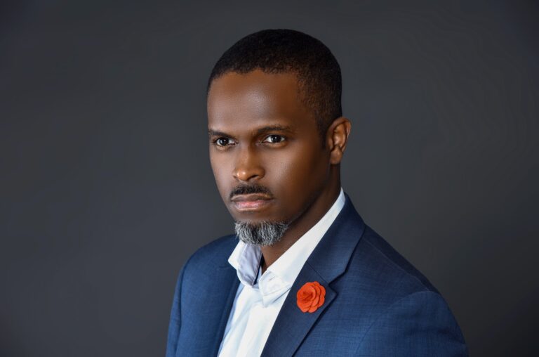 Man in blue suit, charcoal background