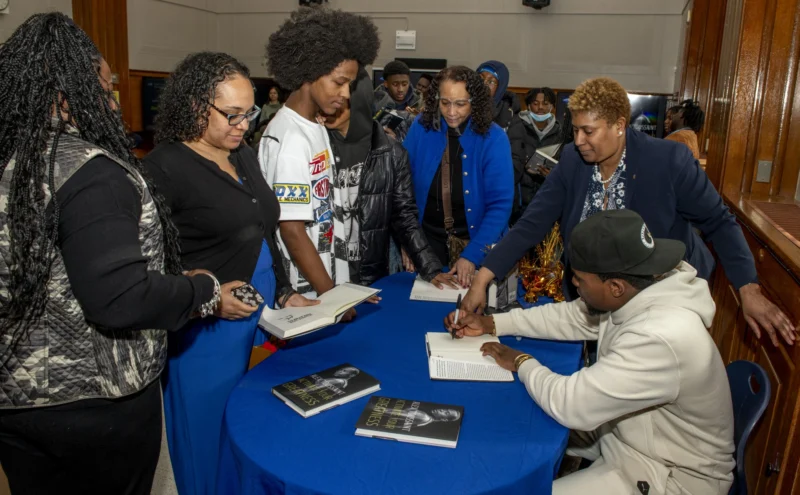 Guests gathered around an event registration table