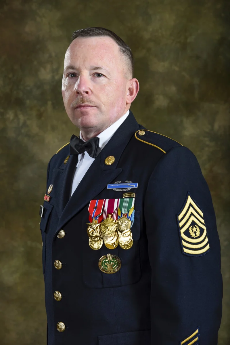 Studio portrait of a man in a decorated dress uniform