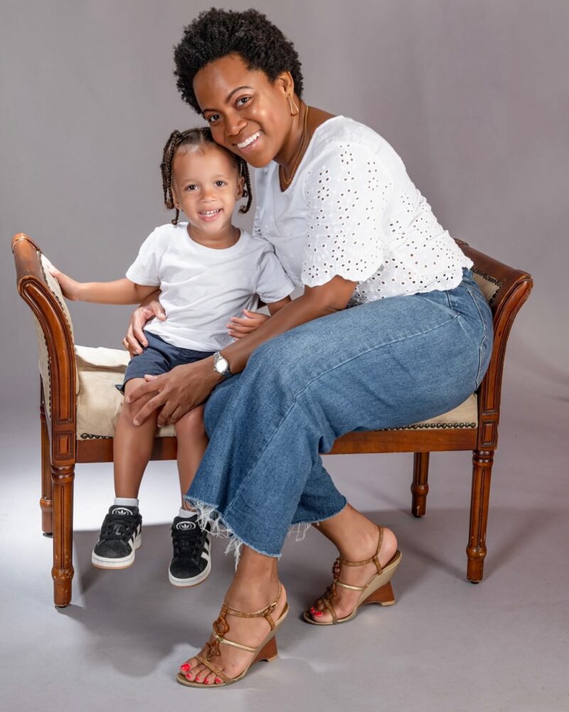 Studio portrait of a mother and child seated together